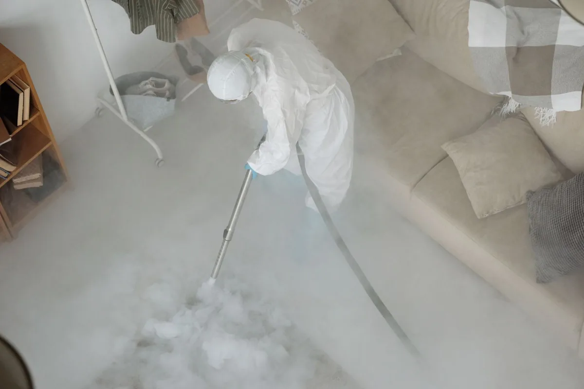 Biohazard cleanup technician in protective equipment, Long Branch, NJ